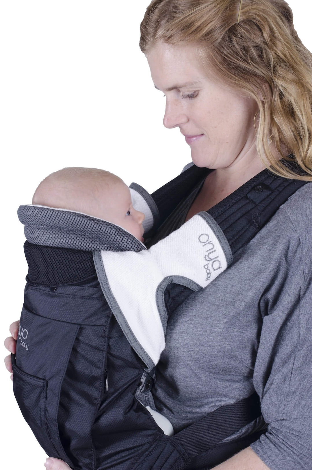 Closeup side view of baby showing head support in an Onya Baby Outback with a Baby Booster Infant Insert