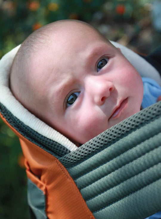 Closeup of baby showing head support in an Onya Baby Outback using a Baby Booster Infant Insert